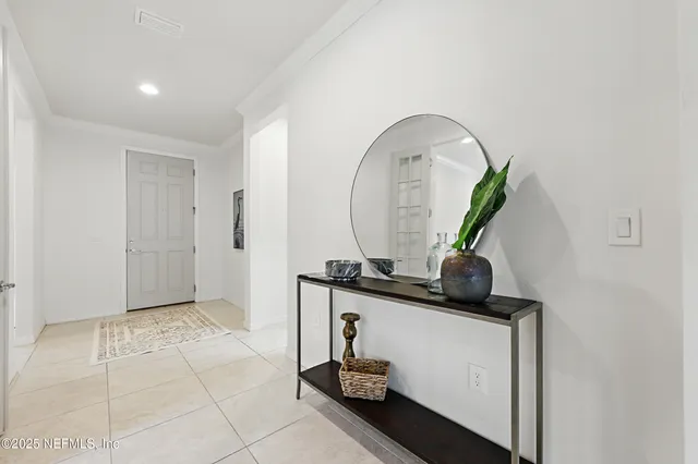 a kitchen with granite countertop white cabinets stainless steel appliances and sink