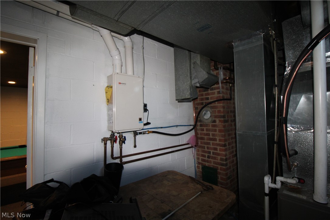 18800 Neff Road Cleveland, OH 44119 - Photo 35 of 38 Basement featuring tankless water heater