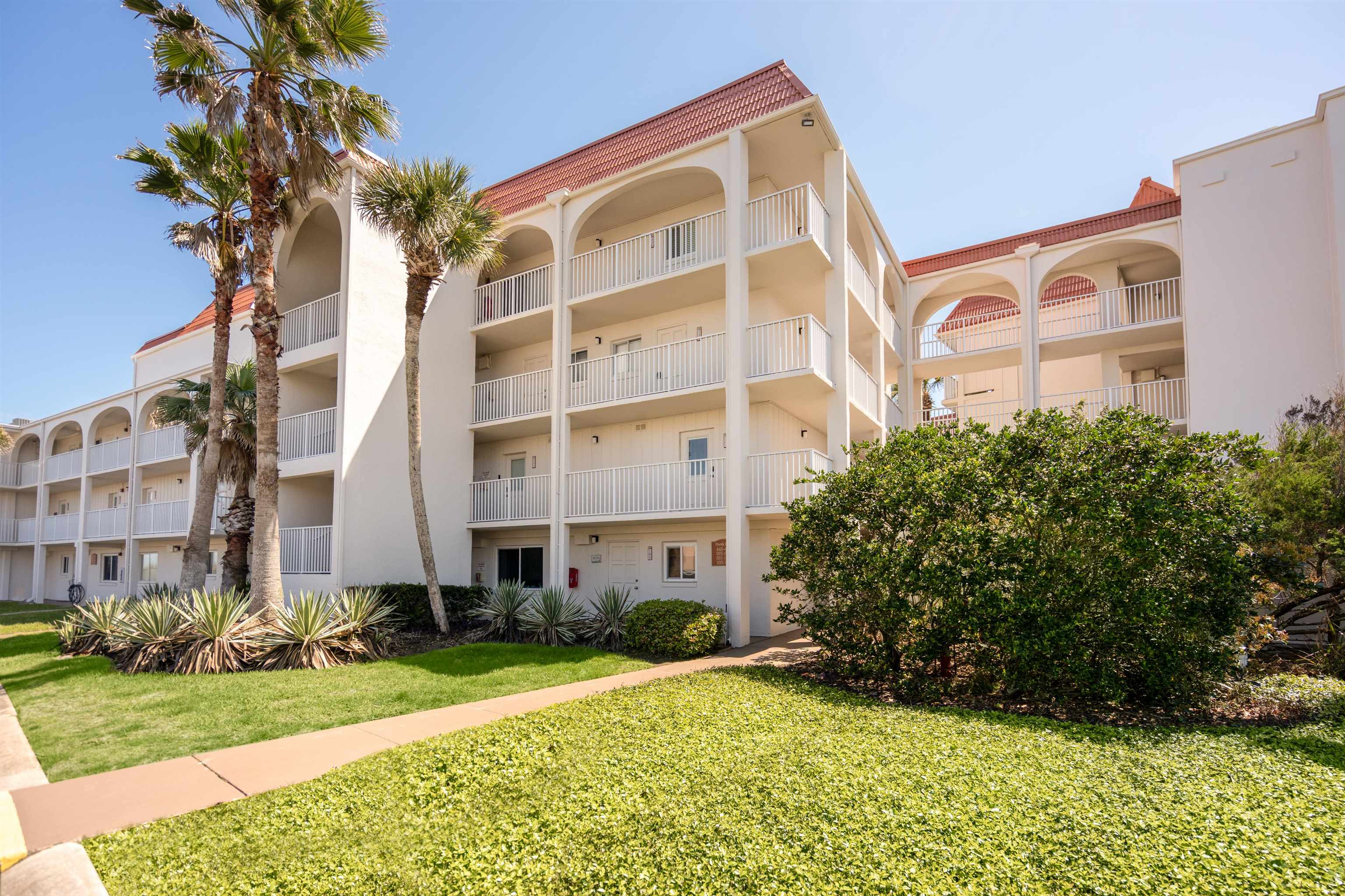 1 Ocean Trace Road, Unit 232 St. Augustine, FL 32080 - Photo 25 of 49 front view of a building with a yard