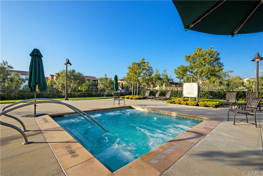 109 Hemisphere Irvine, CA 92618 - Photo 9 of 10 a view of a swimming pool with a lounge chairs