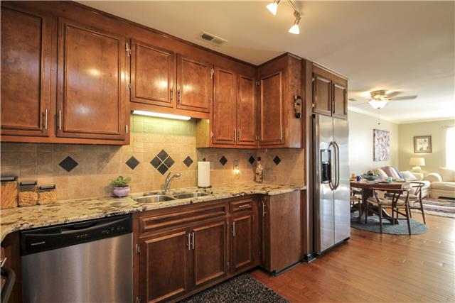 881 General George Patton Road, Unit 881 Nashville, TN 37221 - Photo 4 of 20 Undermount kitchen cabinet lighting and open access to living room and den