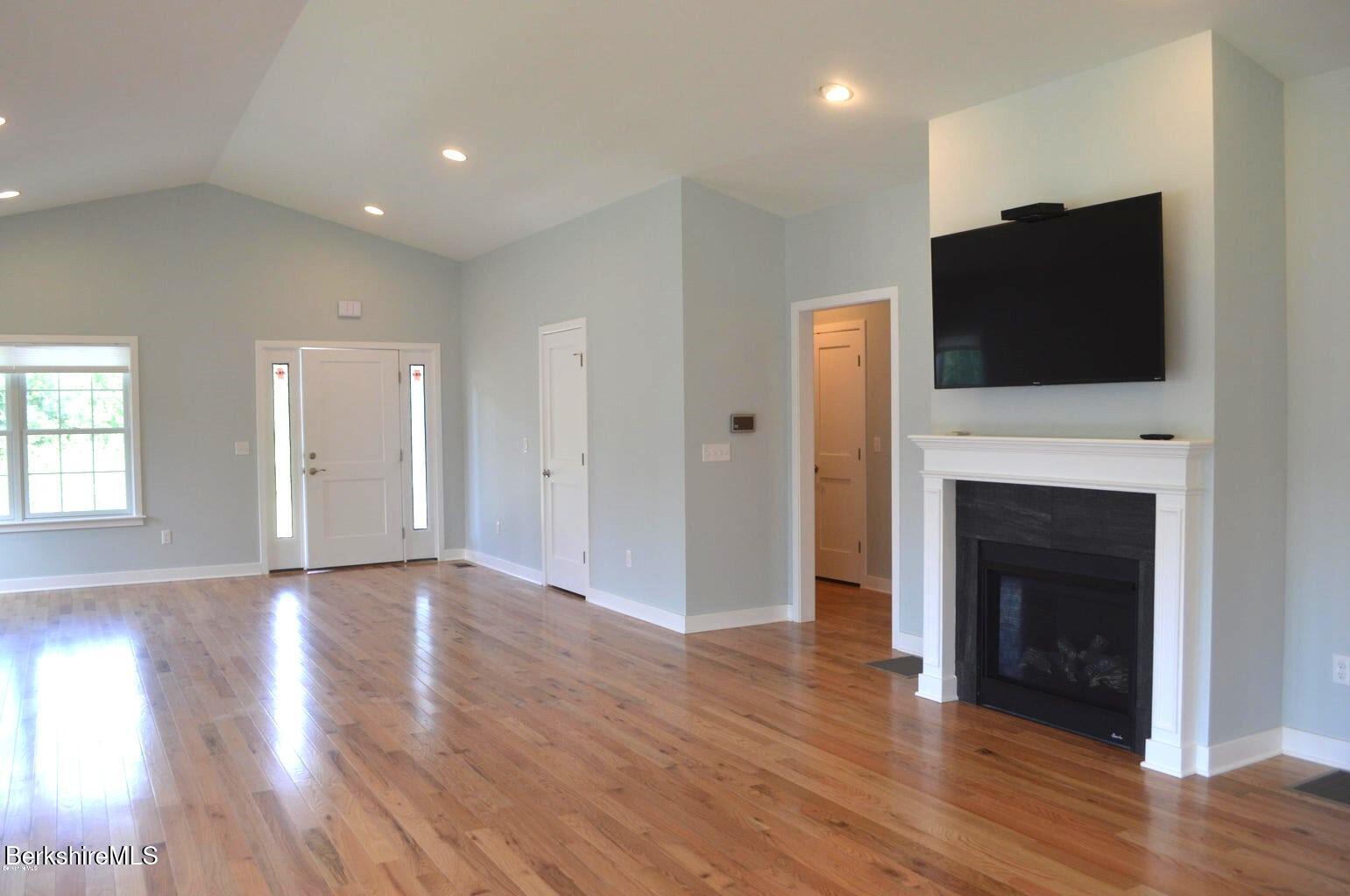 5 Aspen Way Pittsfield, MA 01201 - Photo 8 of 19 a view of a livingroom with an empty space and a fireplace