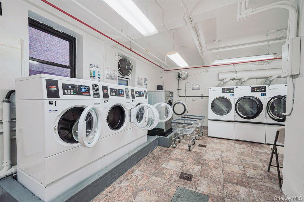 150-15 72nd Road, Unit 5G Queens, NY 11367 - Photo 15 of 27 a utility room with dryer and washer