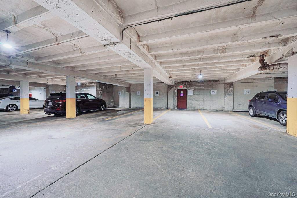 150-15 72nd Road, Unit 5G Queens, NY 11367 - Photo 16 of 27 a view of parking area and car parked