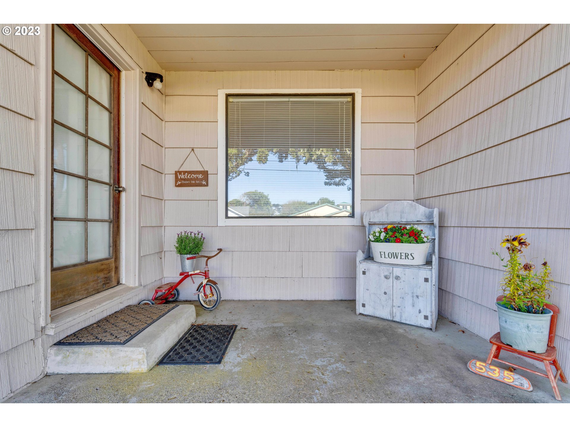535 Edison Avenue Southwest Bandon, OR 97411 - Photo 21 of 33 a bedroom with a bed and a painting on the wall