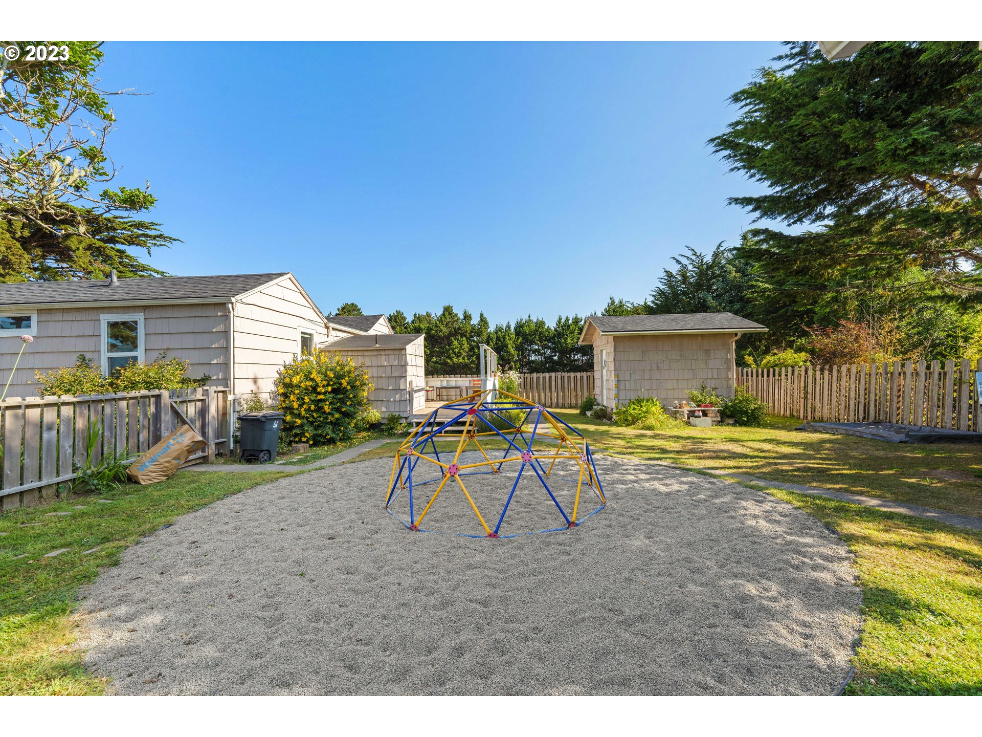 535 Edison Avenue Southwest Bandon, OR 97411 - Photo 27 of 33 a view of a house with backyard and sitting area