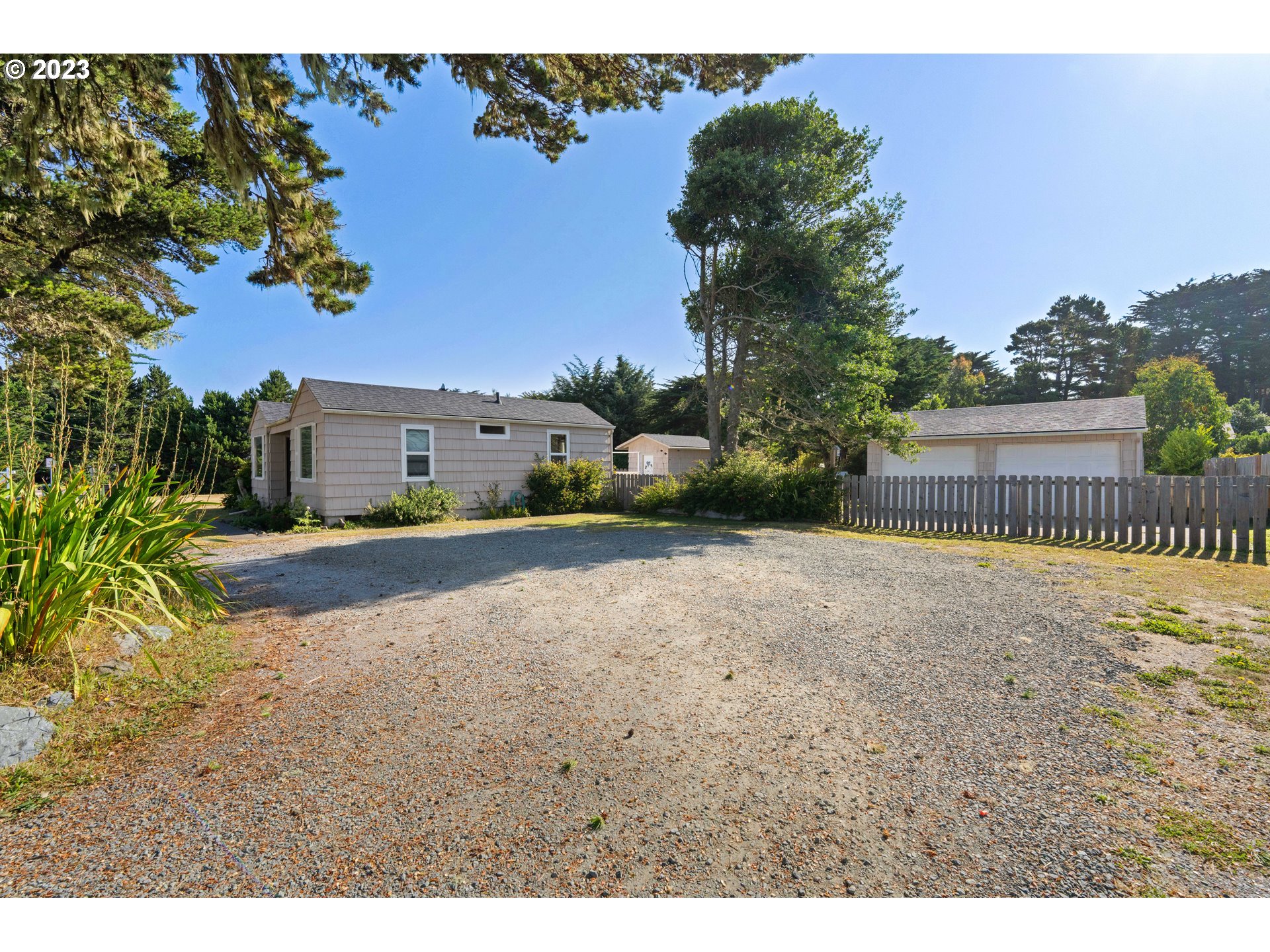 535 Edison Avenue Southwest Bandon, OR 97411 - Photo 4 of 33 a view of backyard of a house