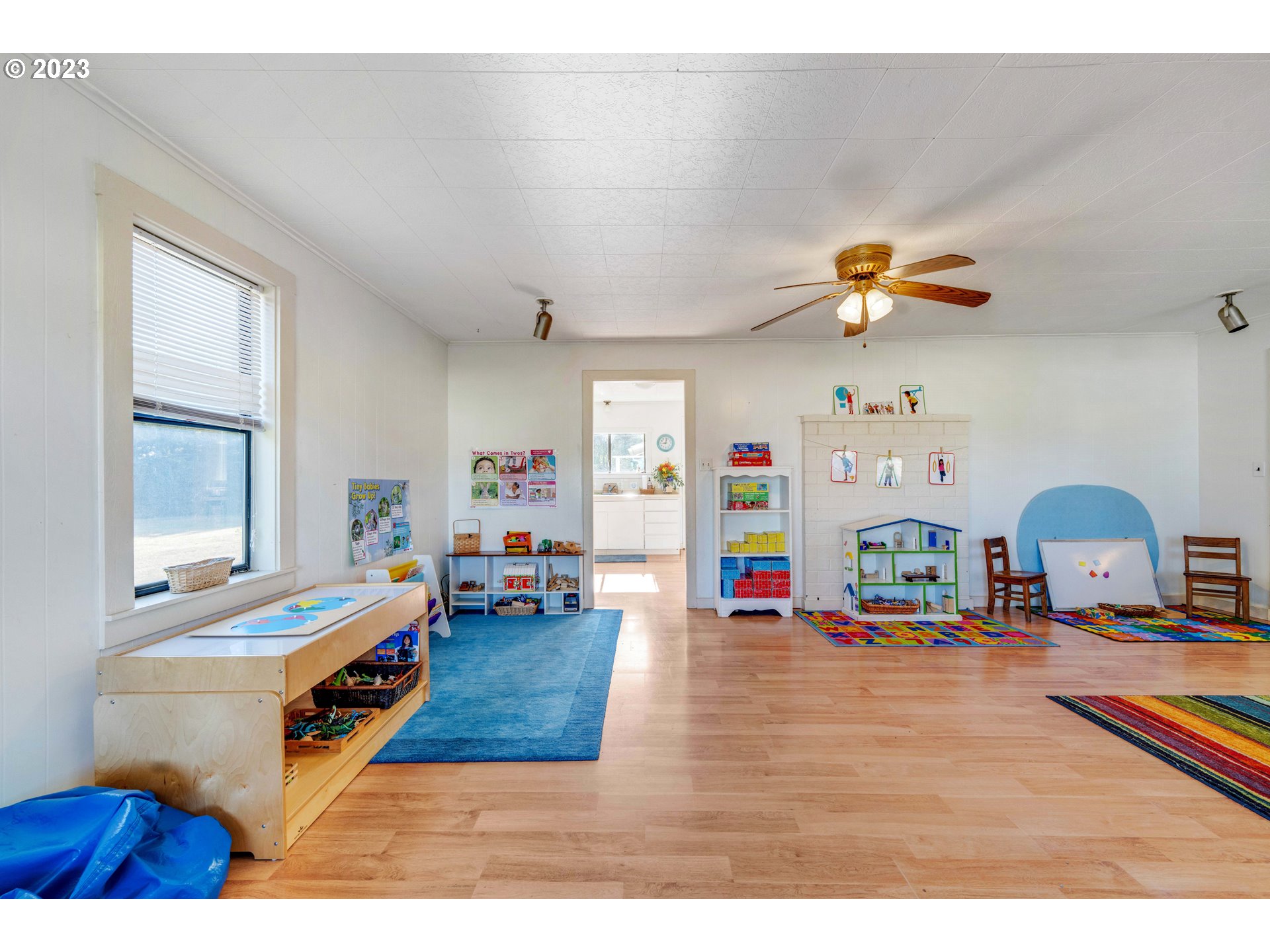 535 Edison Avenue Southwest Bandon, OR 97411 - Photo 7 of 33 a living room with furniture and a chandelier
