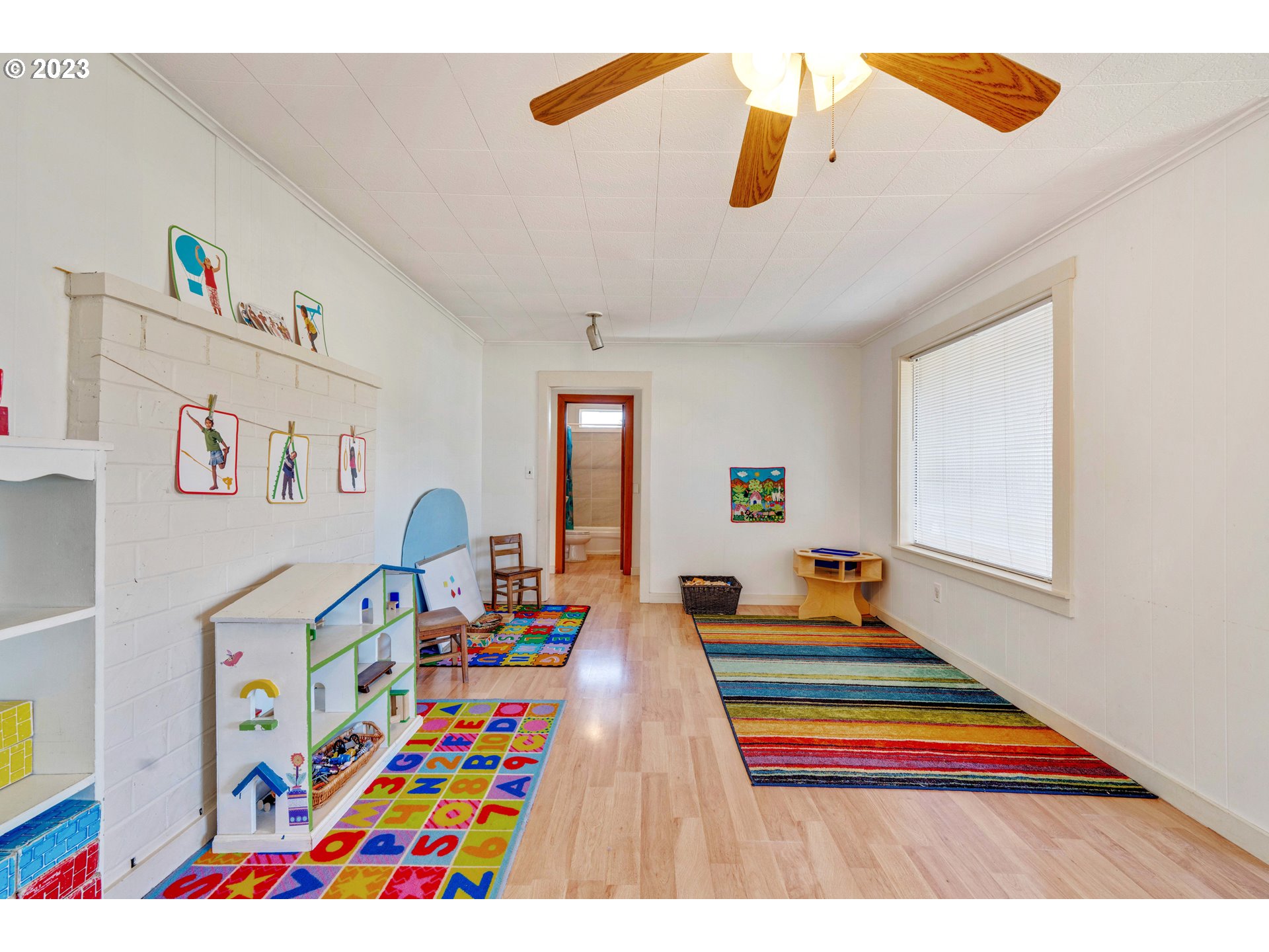 535 Edison Avenue Southwest Bandon, OR 97411 - Photo 9 of 33 a living room with furniture and paintings on the wall