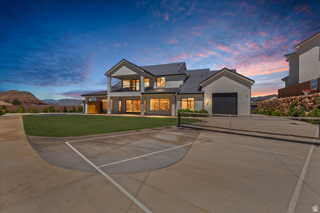 1192 East Corral Way Washington, UT 84780 - Photo 64 of 81 Expansive concrete sport court with net, complemented by a manicured lawn