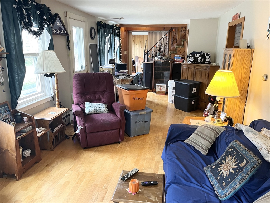 240 Spring Street Hanson, MA 02341 - Photo 14 of 20 a living room with furniture and a lamp