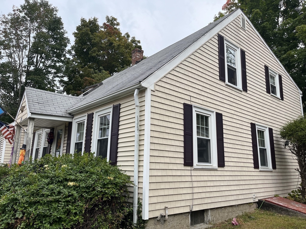 240 Spring Street Hanson, MA 02341 - Photo 4 of 20 a view of a white house next to a yard