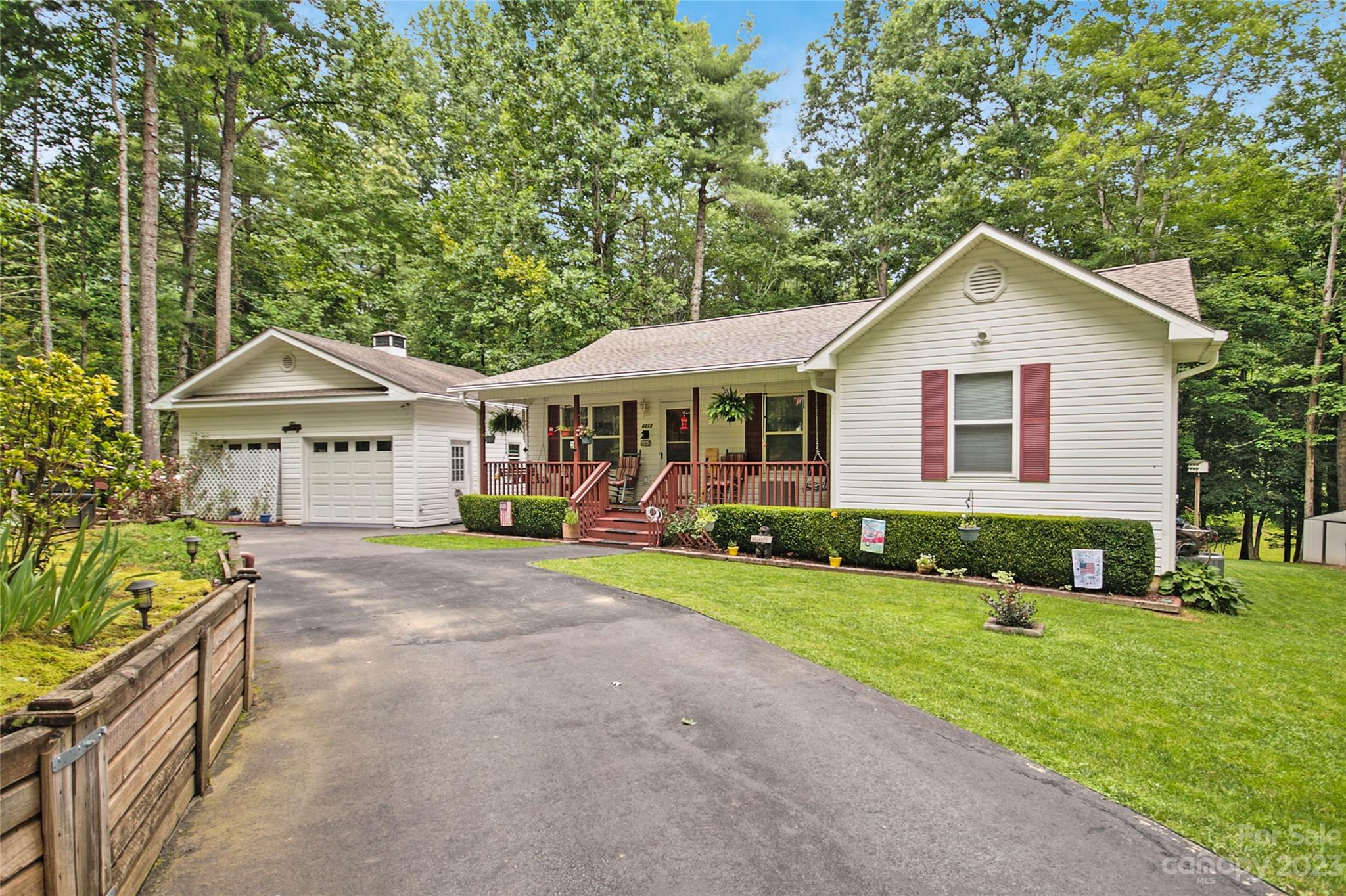 a front view of a house with a yard and porch