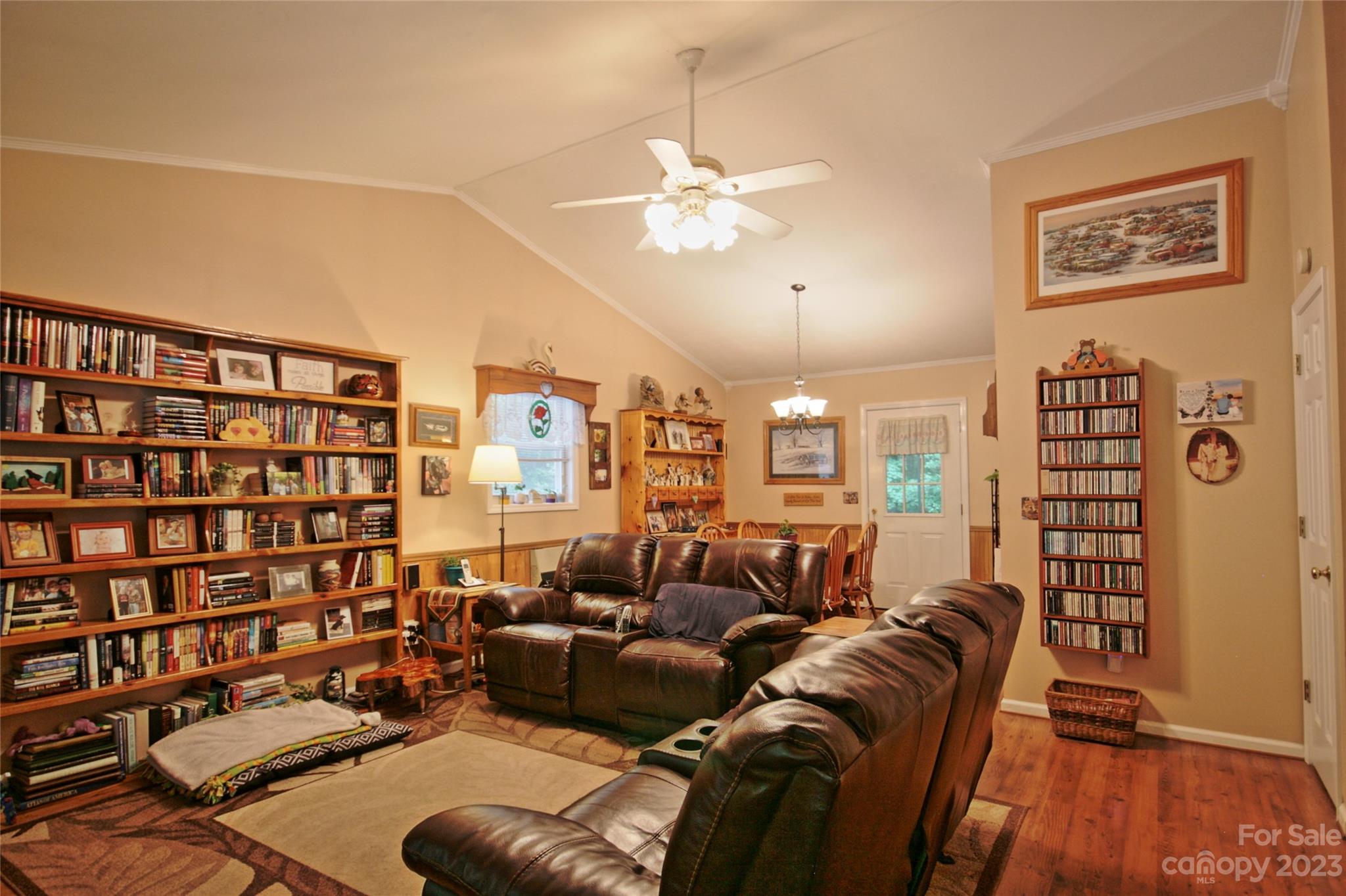 4211 Staton Road Hendersonville, NC 28739 - Photo 2 of 43 a living room with furniture a lamp and a book shelf