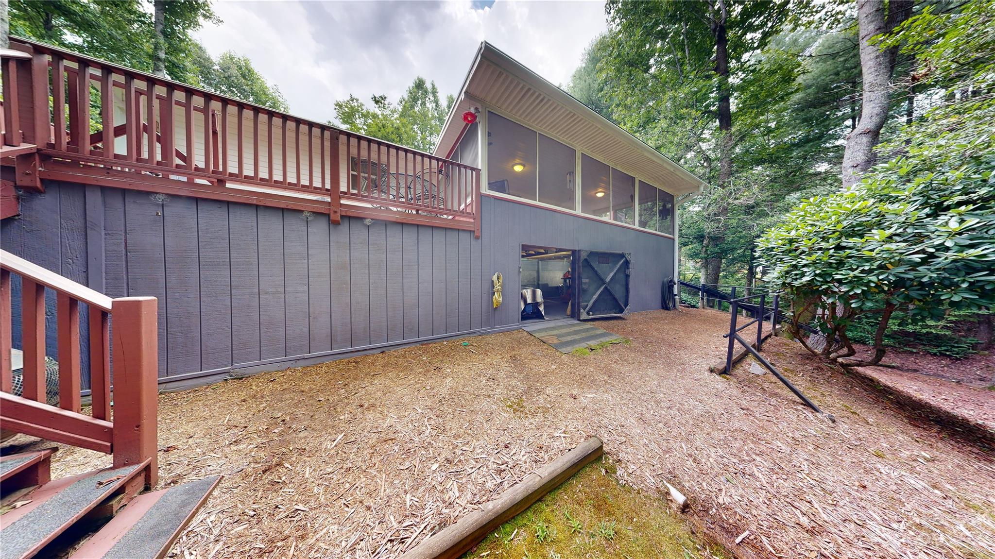 4211 Staton Road Hendersonville, NC 28739 - Photo 23 of 43 a view of backyard with wooden fence and a bench