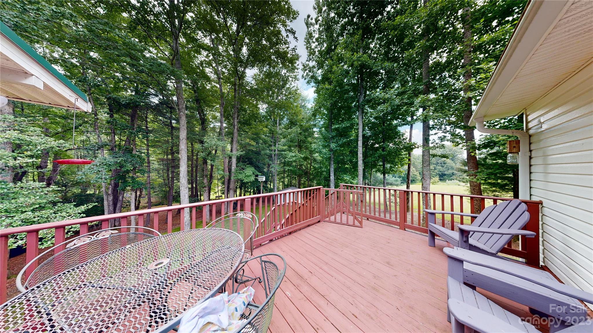 4211 Staton Road Hendersonville, NC 28739 - Photo 29 of 43 a view of balcony with wooden floor and outdoor seating