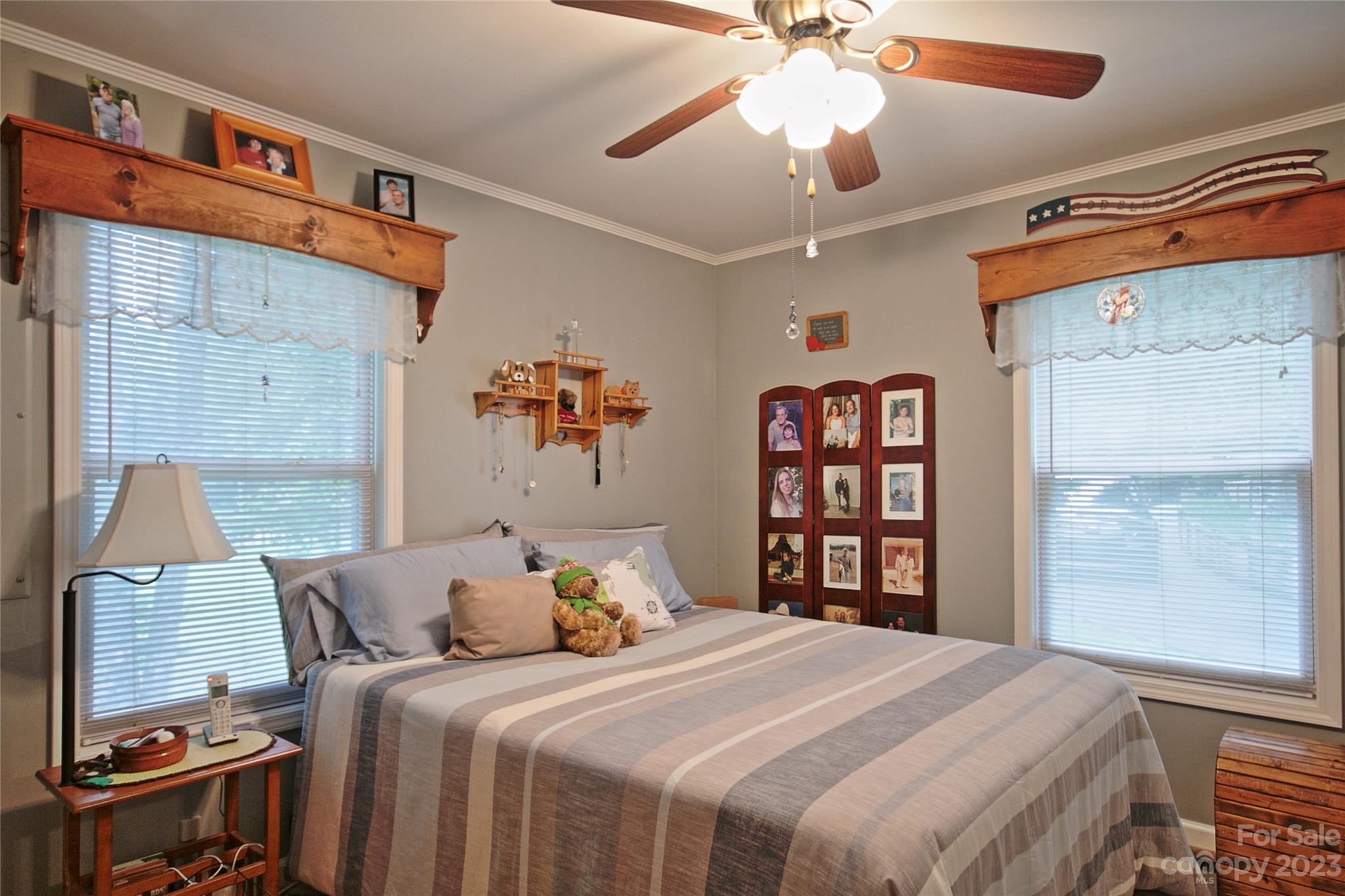 4211 Staton Road Hendersonville, NC 28739 - Photo 6 of 43 a bedroom with a bed and a chandelier