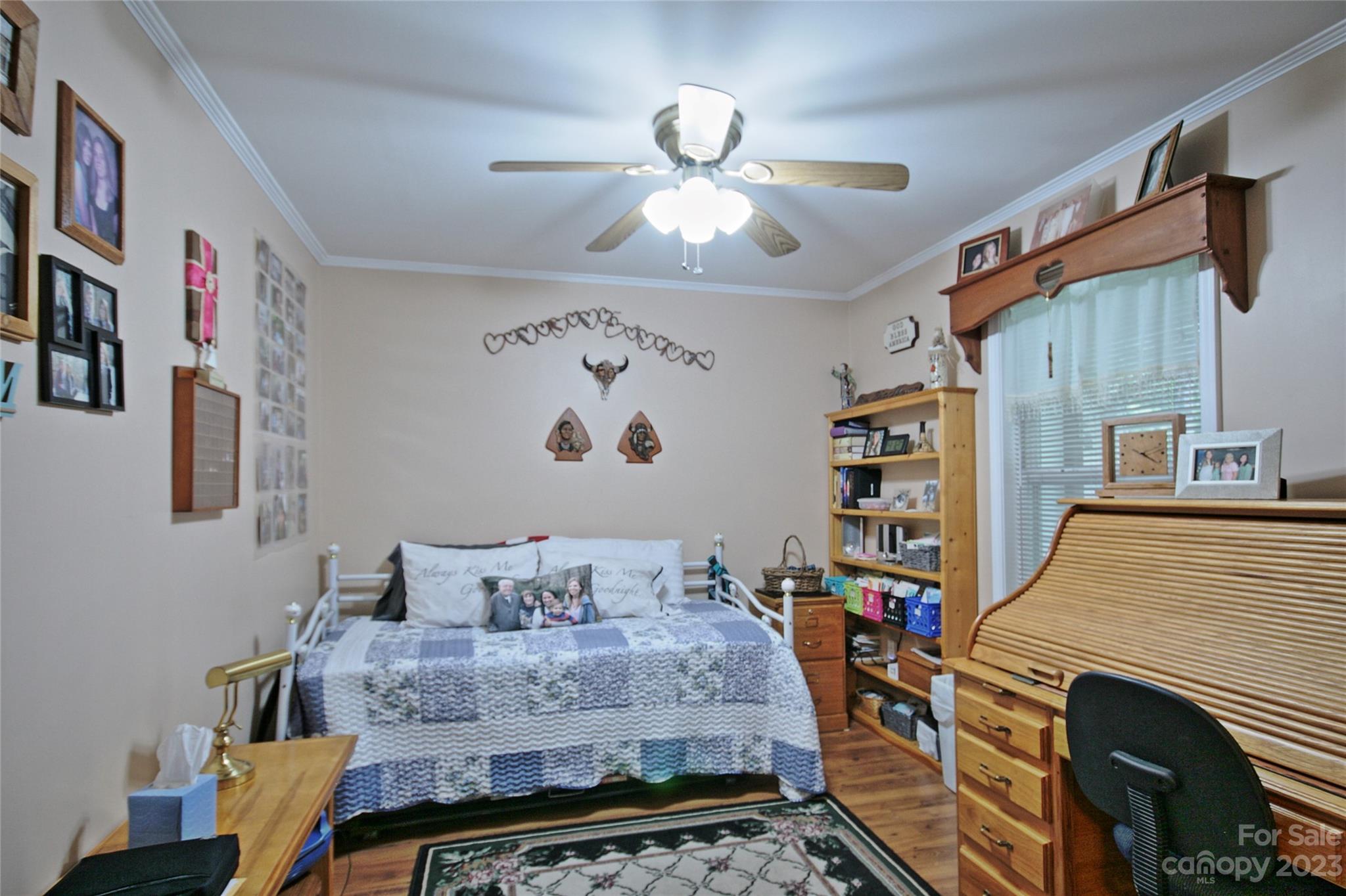 4211 Staton Road Hendersonville, NC 28739 - Photo 7 of 43 a bedroom with a bed and a chandelier