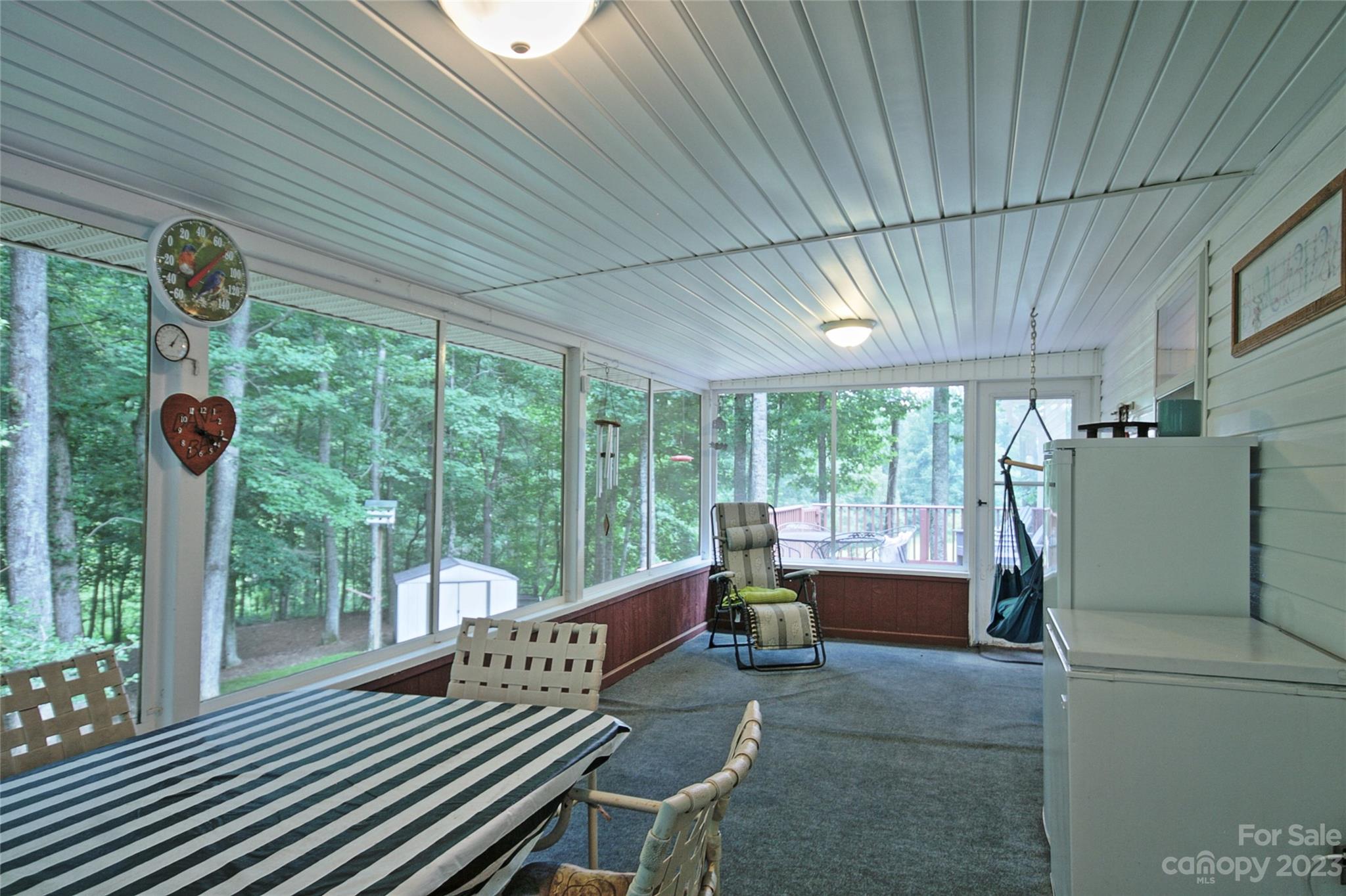 4211 Staton Road Hendersonville, NC 28739 - Photo 10 of 43 a roof deck with table and chairs and potted plants