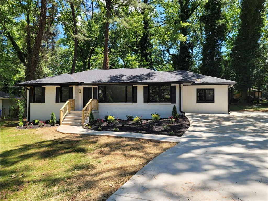 2789 Mitchell Drive Decatur, GA 30032 - Photo 1 of 1 a view of a house with backyard and windows
