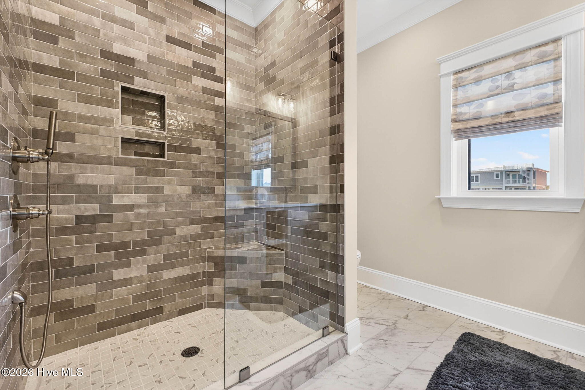 1416 Riverside Drive Sunset Beach, NC 28468 - Photo 43 of 83 Custom tile shower with textured finishes and contemporary coastal style.