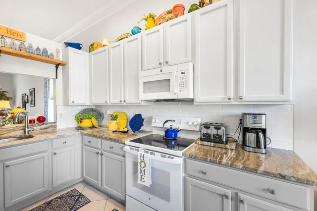 a front view of house with yard and outdoor seating