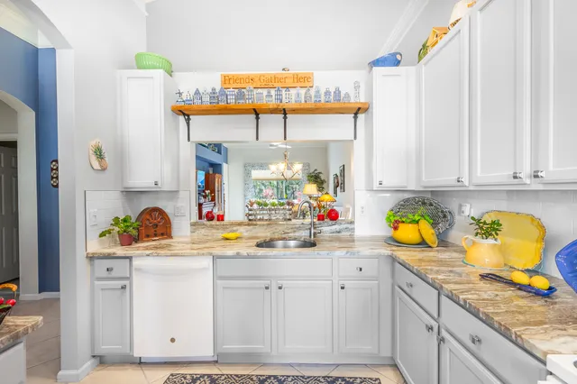 a bathroom with a sink a toilet and shower curtain