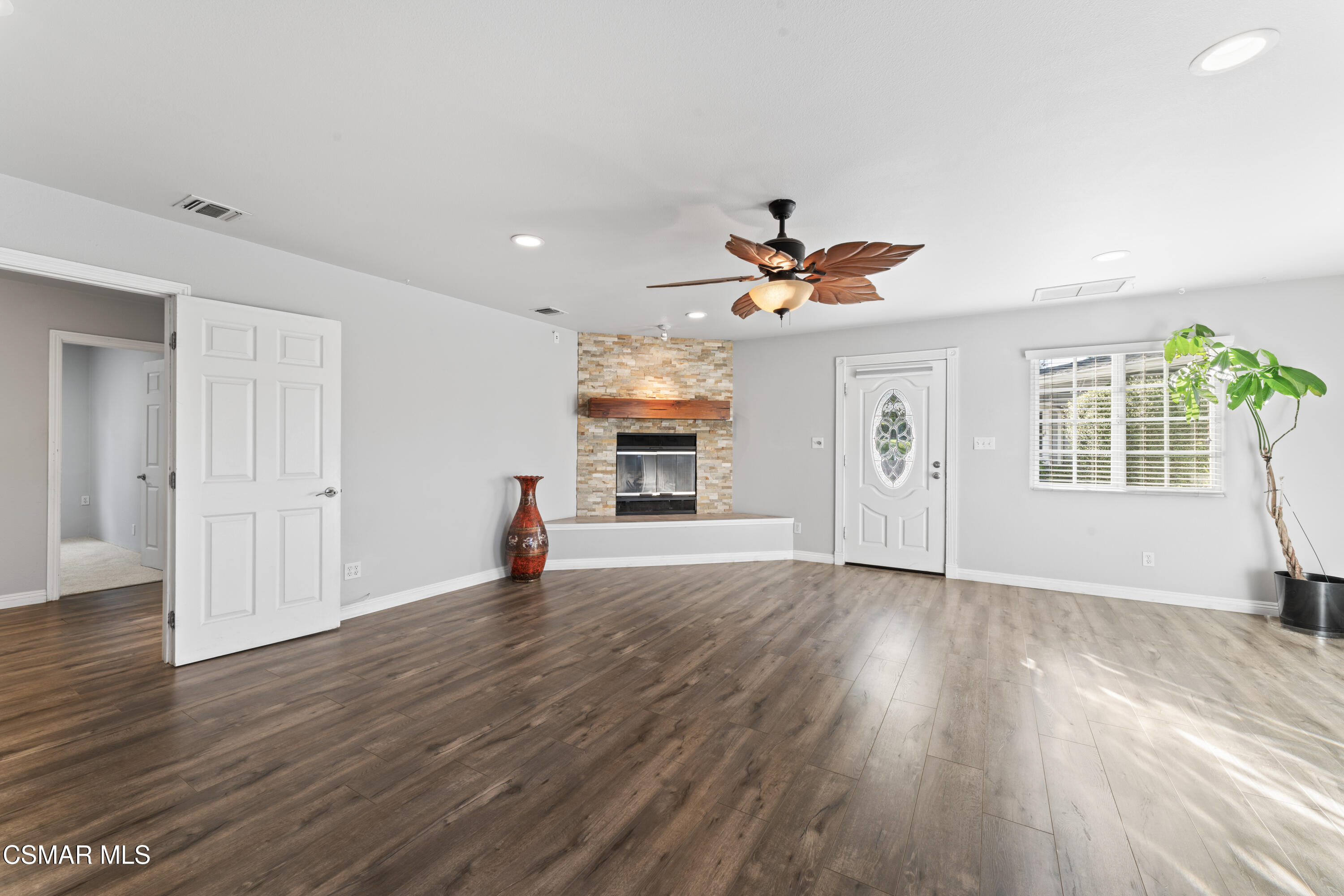 636 Sinaloa Road Simi Valley, CA 93065 - Photo 14 of 31 a view of a livingroom with a fireplace wooden floor and a window