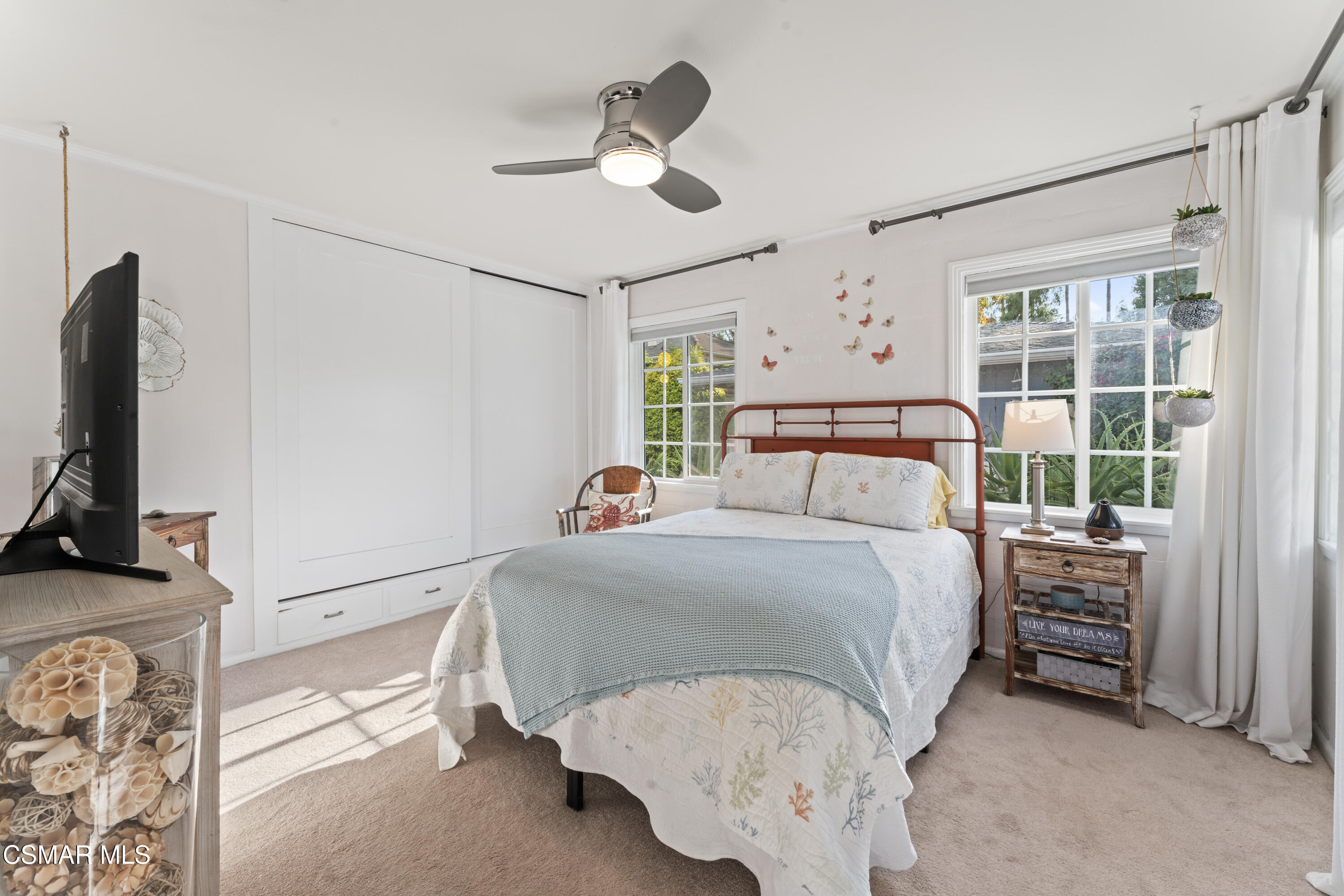 636 Sinaloa Road Simi Valley, CA 93065 - Photo 7 of 31 a bedroom with a bed and a flat tv screen on dresser