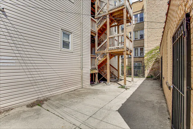 a view of a brick house with a large window
