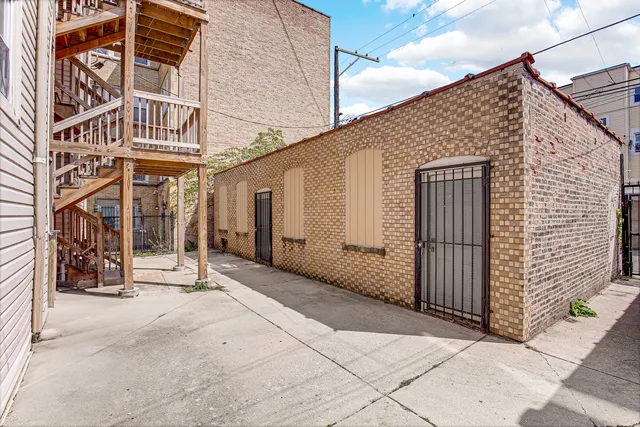 a view of a house with brick walls