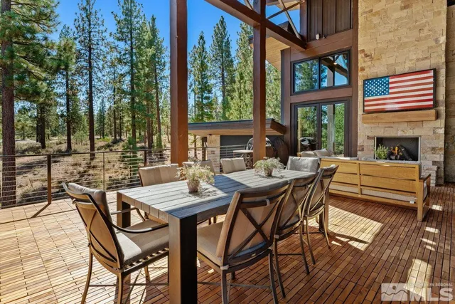a view of a patio with a table and chairs