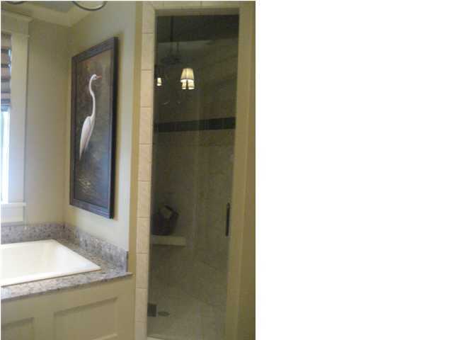 38 Grande Pointe Circle Inlet Beach, FL 32461 - Photo 20 of 30 a bathroom with a granite countertop sink and shower