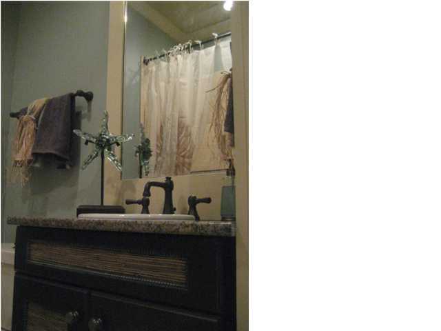 38 Grande Pointe Circle Inlet Beach, FL 32461 - Photo 10 of 30 a bathroom with a granite countertop sink and a mirror