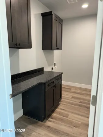 a kitchen with a sink and a microwave