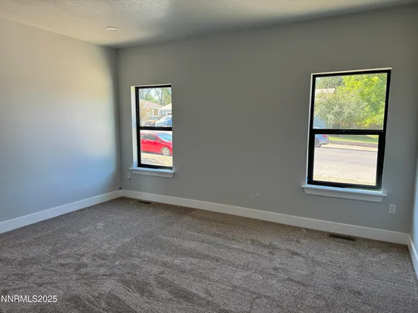 an empty room with windows