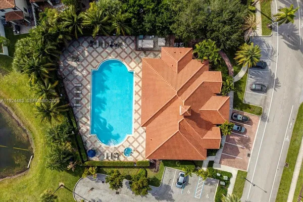 an aerial view of a house with a swimming pool