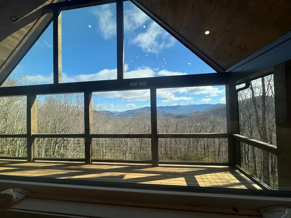 a view of a glass door with a living room