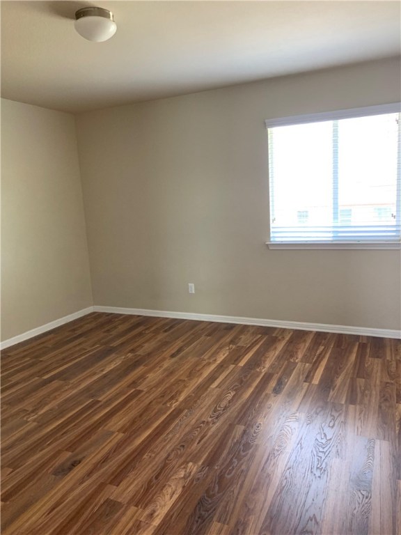 151 Chickadee Cove Kyle, TX 78640 - Photo 17 of 29 a view of a room with wooden floor and window