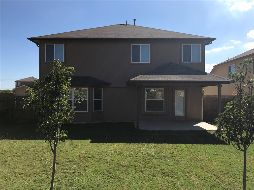 151 Chickadee Cove Kyle, TX 78640 - Photo 23 of 29 a front view of a house with garden