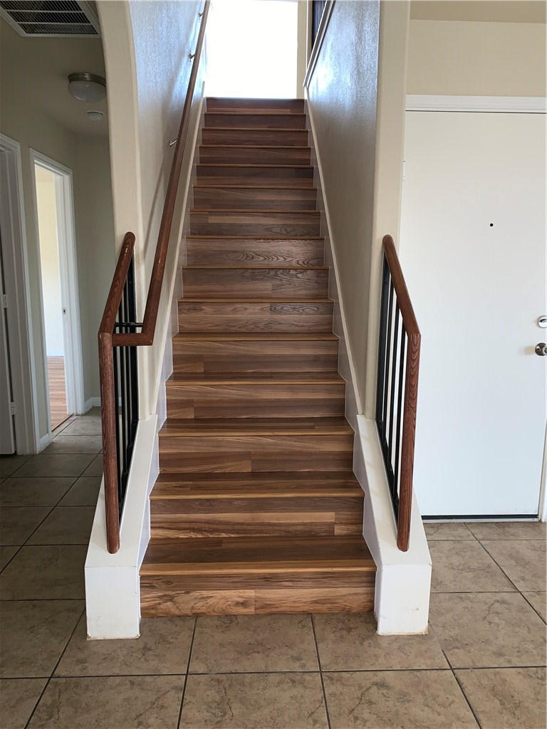 151 Chickadee Cove Kyle, TX 78640 - Photo 28 of 29 Even the Stairs Have Newly Installed Wood Laminant