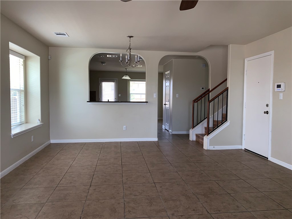 151 Chickadee Cove Kyle, TX 78640 - Photo 29 of 29 a view of a livingroom with wooden floor and staircase