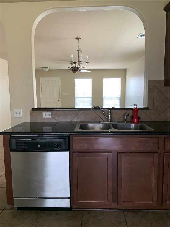 151 Chickadee Cove Kyle, TX 78640 - Photo 4 of 29 a kitchen with stainless steel appliances granite countertop a stove and a sink