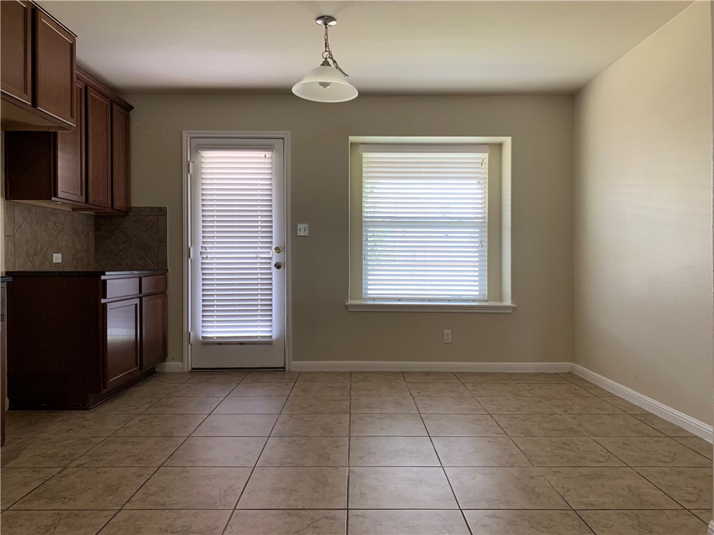 151 Chickadee Cove Kyle, TX 78640 - Photo 6 of 29 a view of kitchen with windows