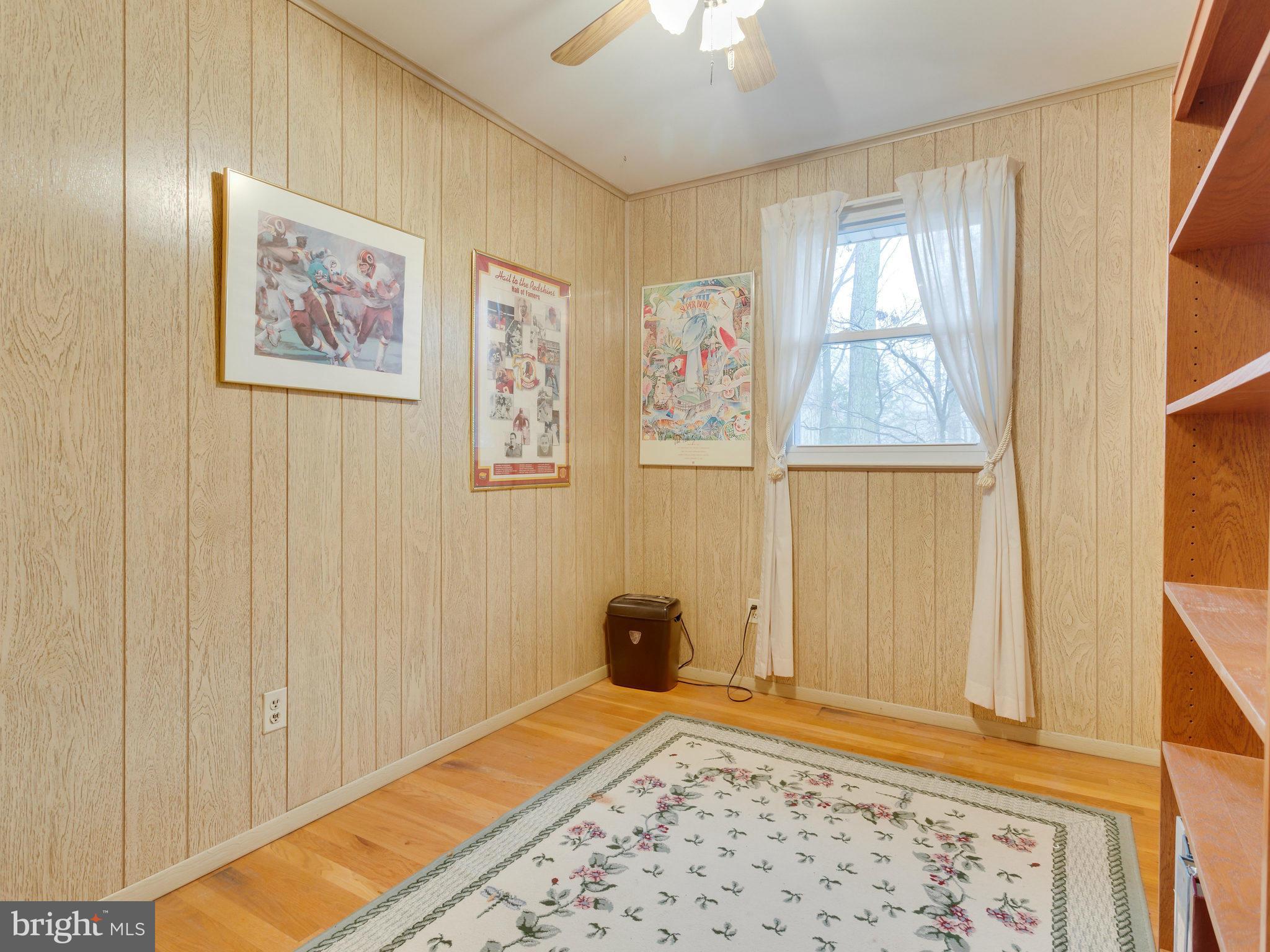8613 Victoria Road Springfield, VA 22151 - Photo 11 of 21 a bedroom with a bed and a window
