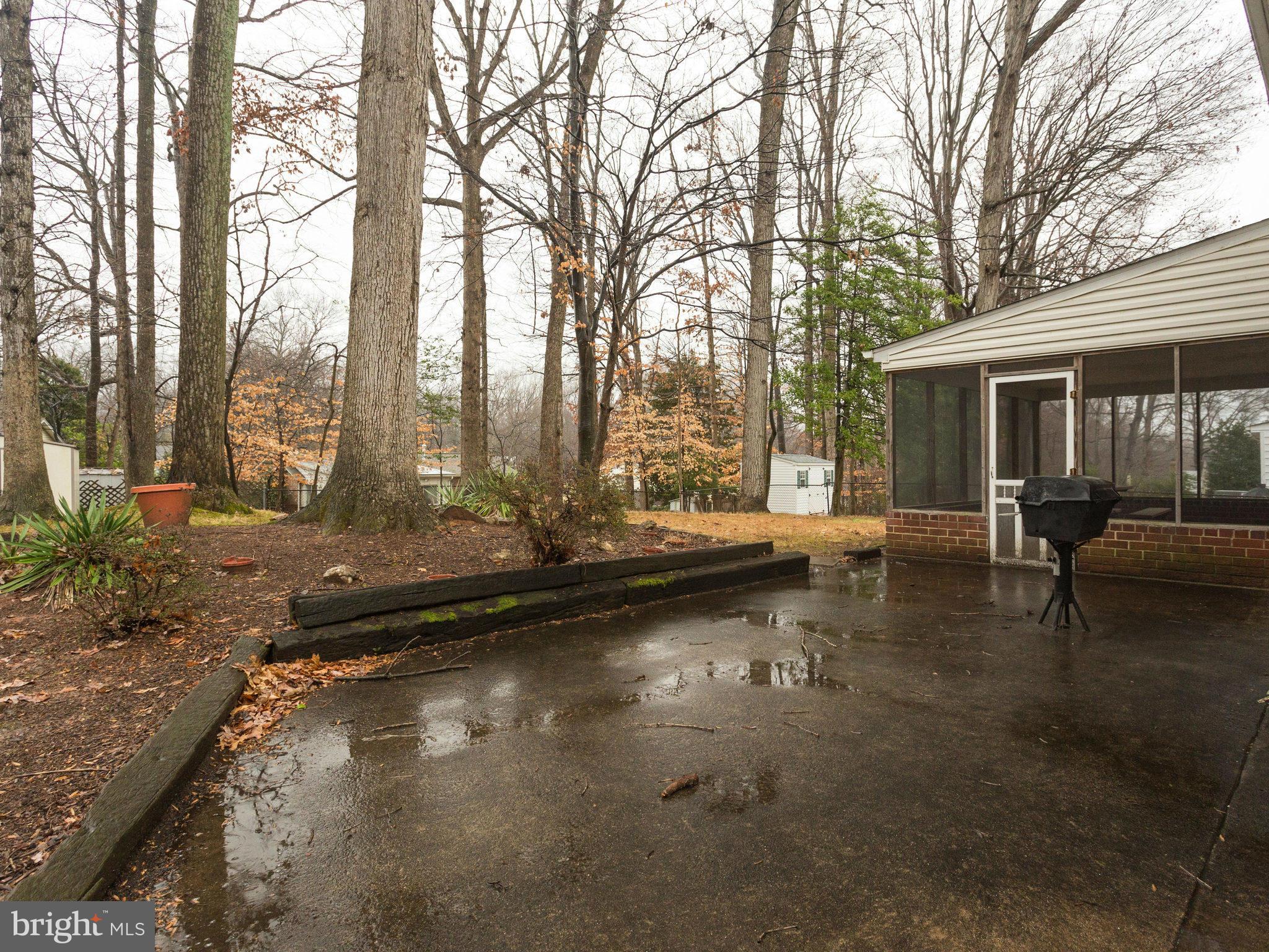 8613 Victoria Road Springfield, VA 22151 - Photo 19 of 21 a view of a patio with a yard