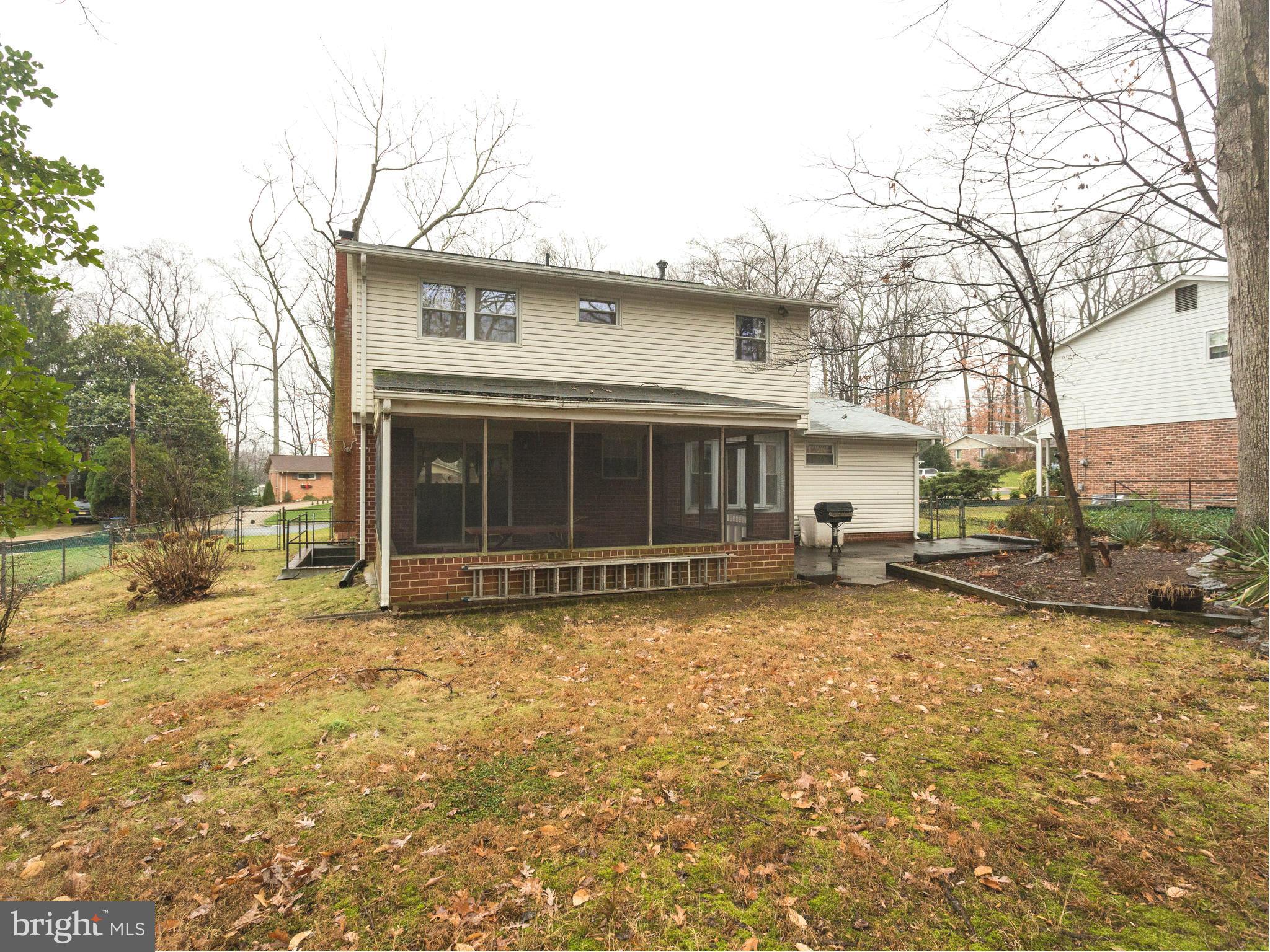 8613 Victoria Road Springfield, VA 22151 - Photo 20 of 21 a view of a house with a yard and sitting area