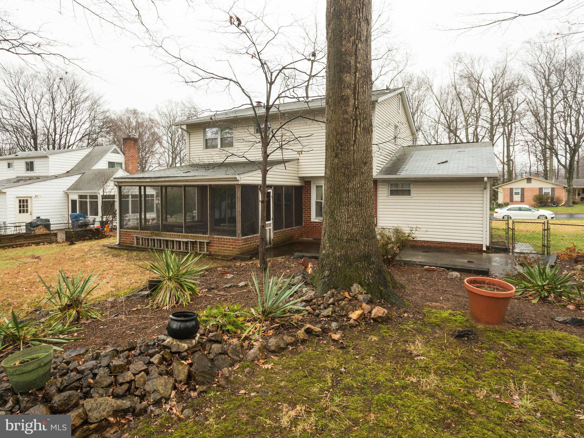 8613 Victoria Road Springfield, VA 22151 - Photo 21 of 21 a view of a house with backyard and sitting area