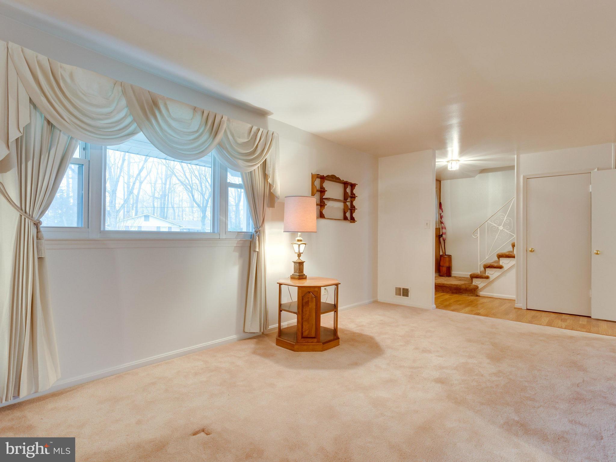 8613 Victoria Road Springfield, VA 22151 - Photo 6 of 21 a view of a livingroom with furniture and a window
