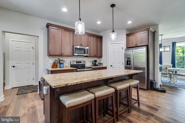 a view of living room with granite countertop furniture and a sink